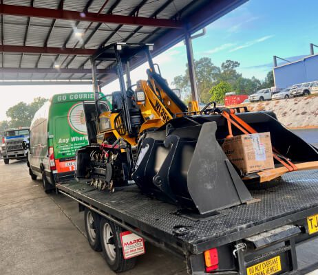  Go Couriers Van Hauling Crawler Tractor at Go Couriers